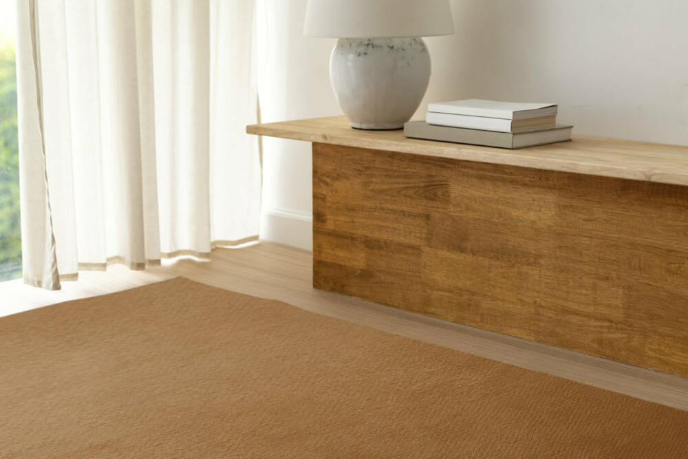 A Brich Plywood Sheet table near by window with white curtain.